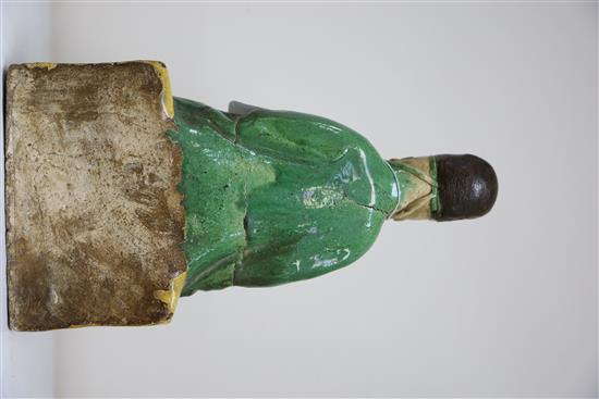 A Chinese sancai ridge tile modelled as the seated figure of Guandi, Ming dynasty, H. 30cm
